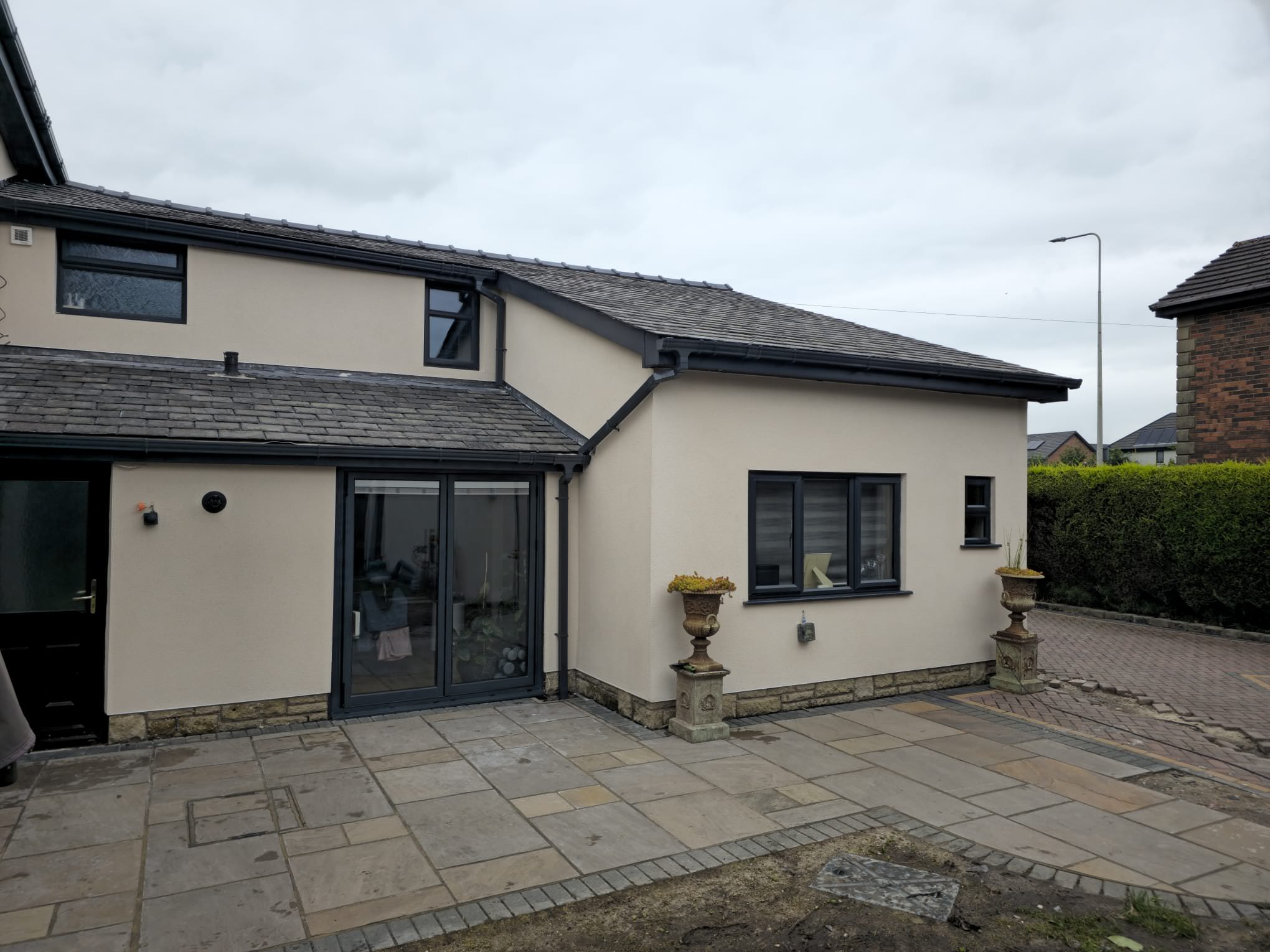 Thin coat rendering on Preston home exterior