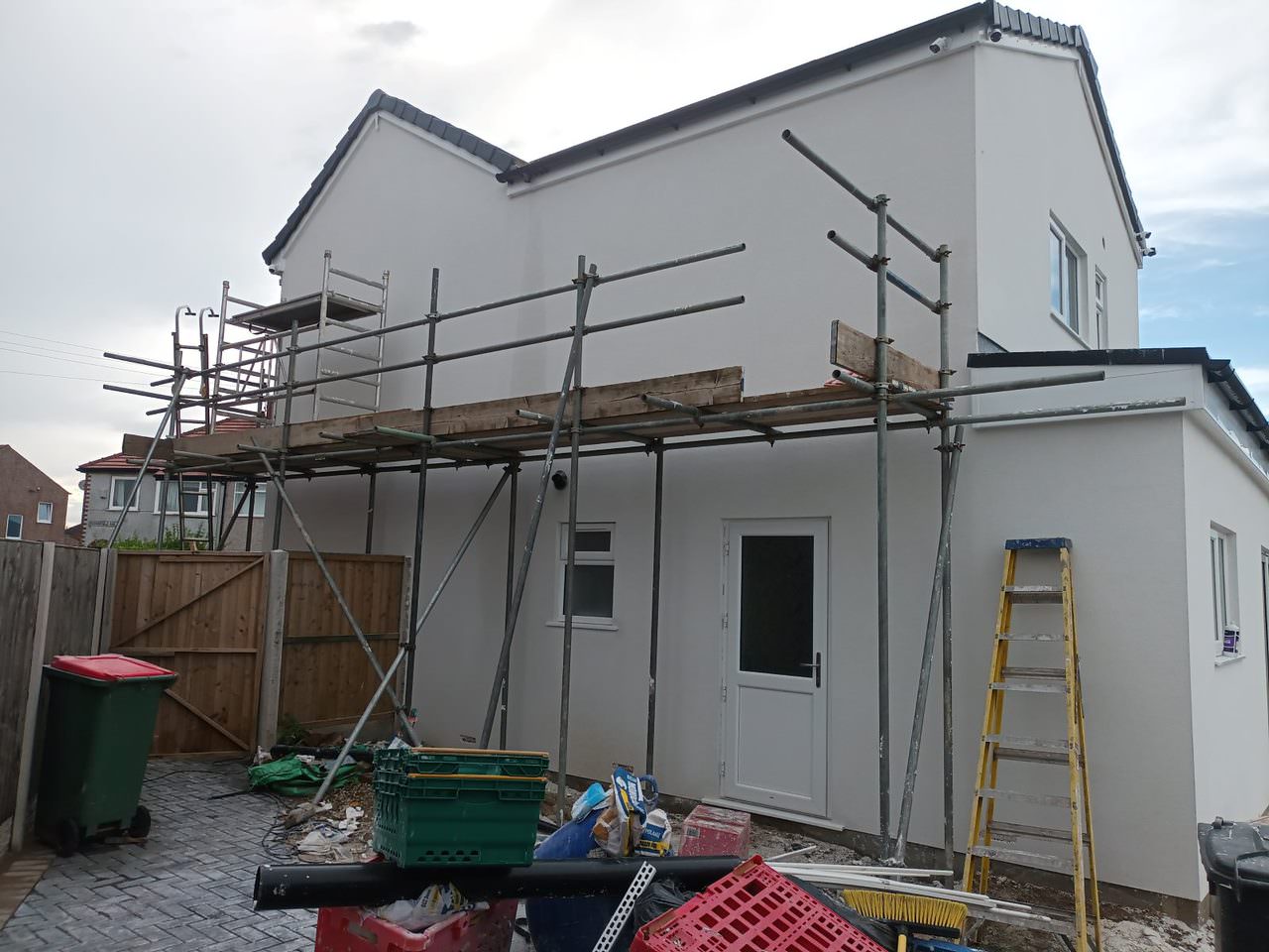 Lime rendering application on exterior wall in Preston